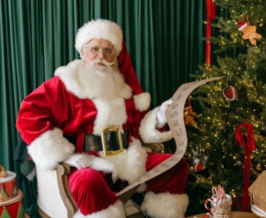 Santa with children in a Christmas living room