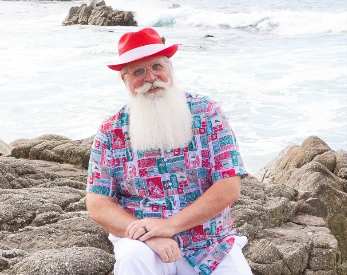 Santa surprising children at a summer backyard party